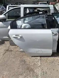17 Kia K2 · Right rear door · dented