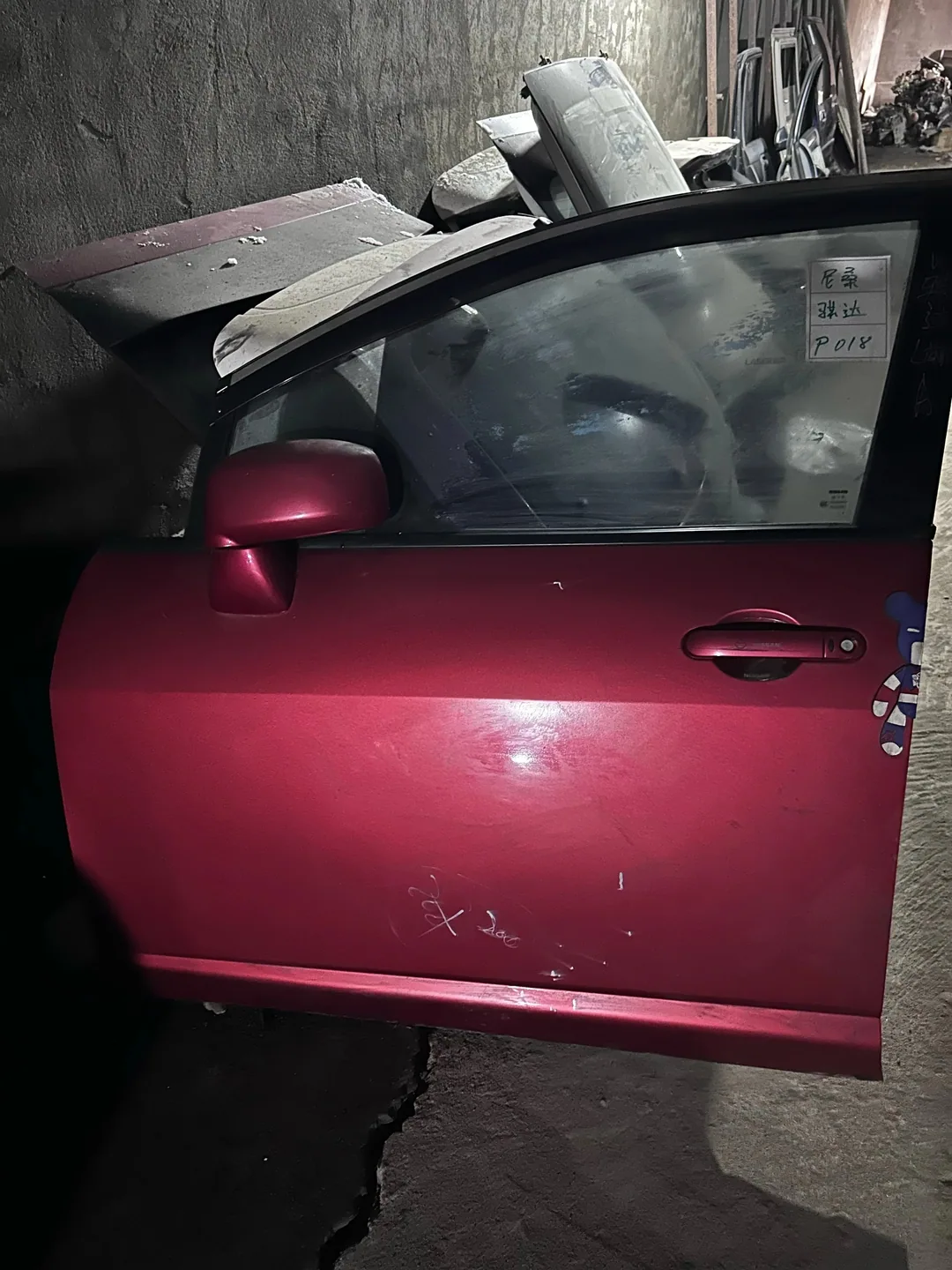 Nissan Tiida · ປະຕູໜ້າຊ້າຍ