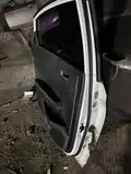 Hyundai Verna · Puerta trasera izquierda · con daños 7