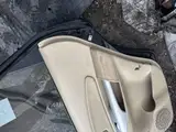 Tucson · Modelo antigo · Porta traseira direita 5
